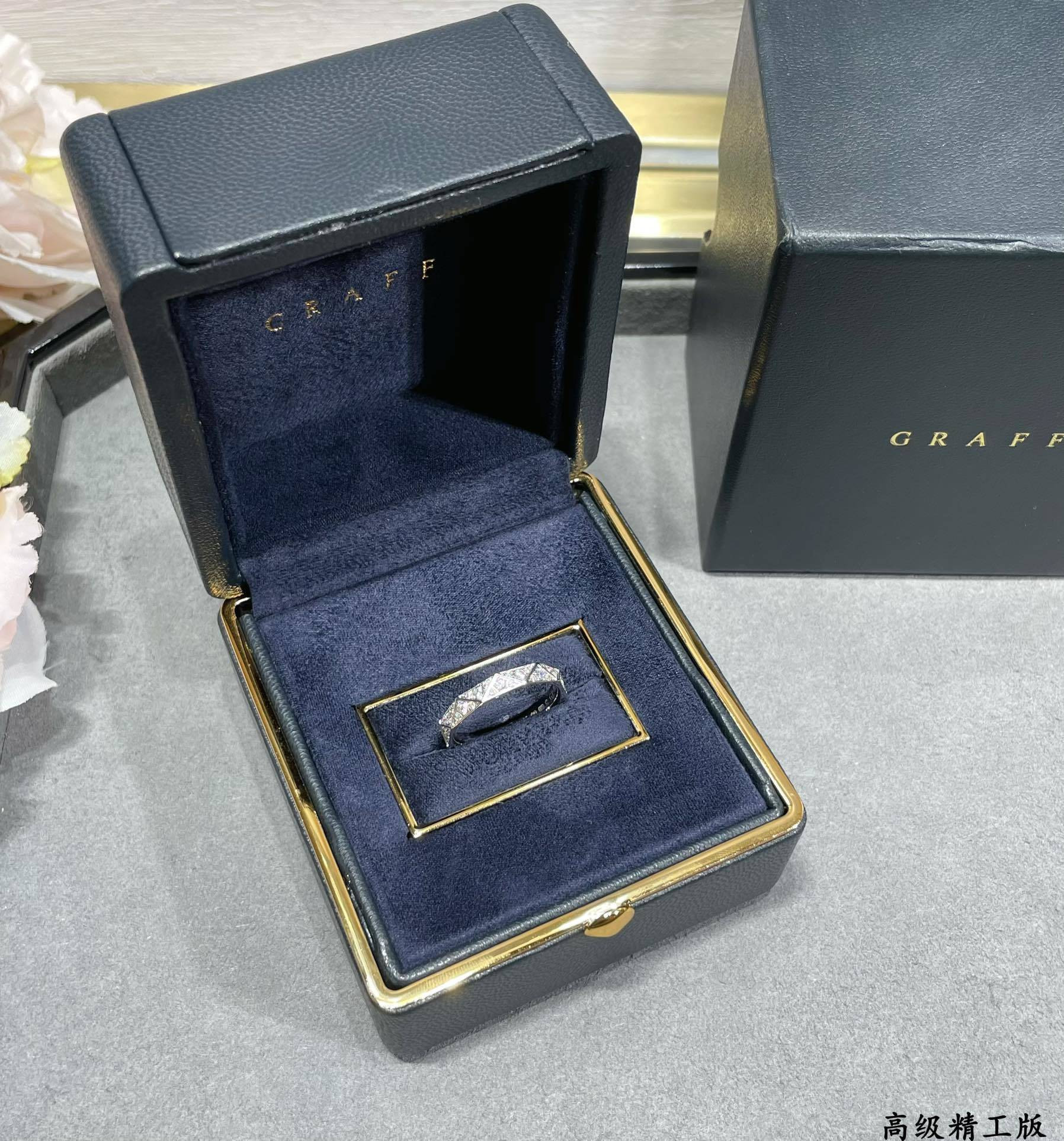 Gr*ff di*m*nd-encrusted rhombus ring