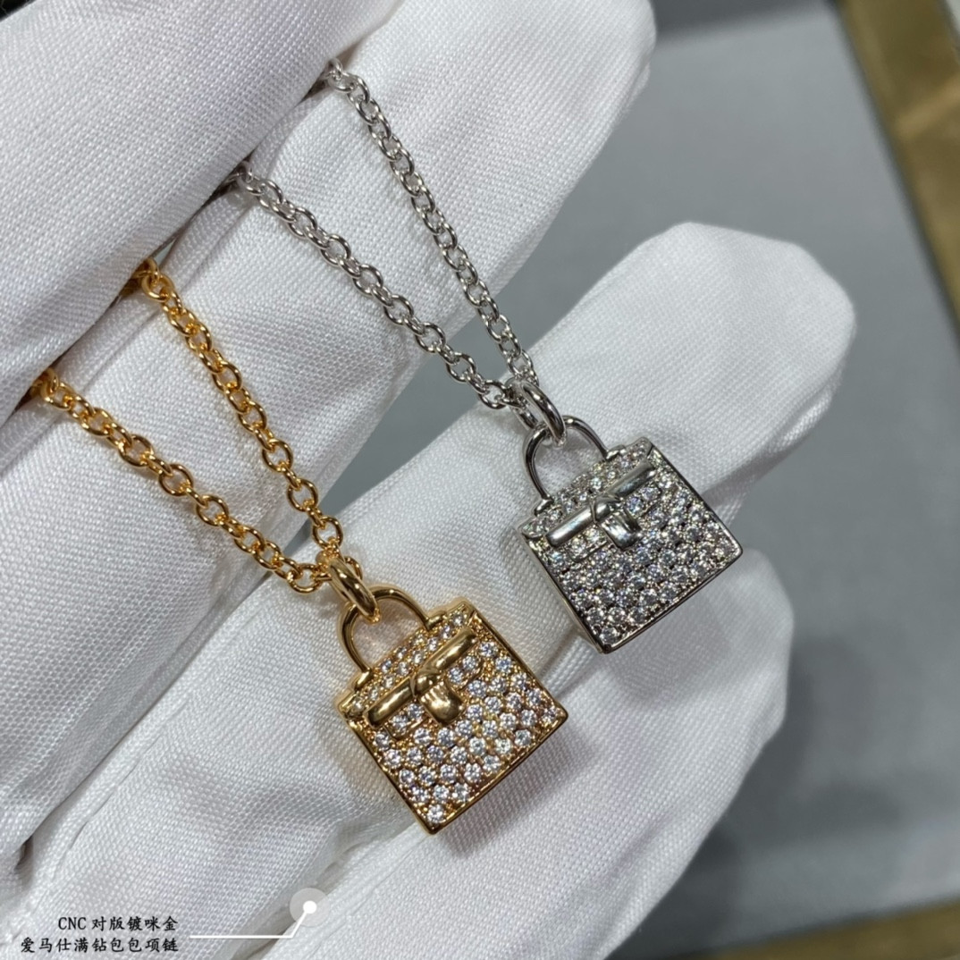 H**me5 fully di*m*nd-encrusted bag necklace