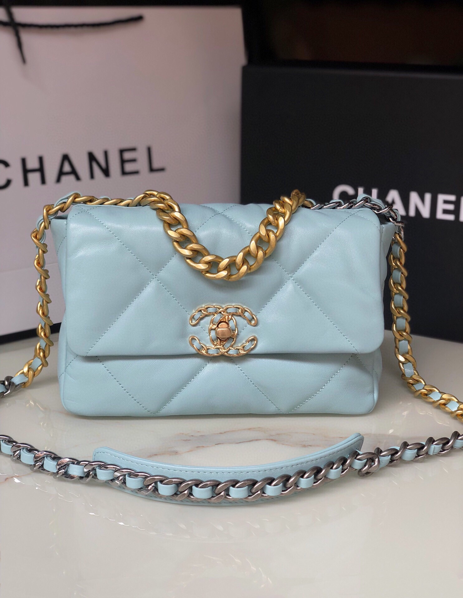 Ch*el 19 handbag shiny leather, gold-tone, silver-tone & ruthenium-finish metal light blue 6.2 × 10.1 × 3.5 in