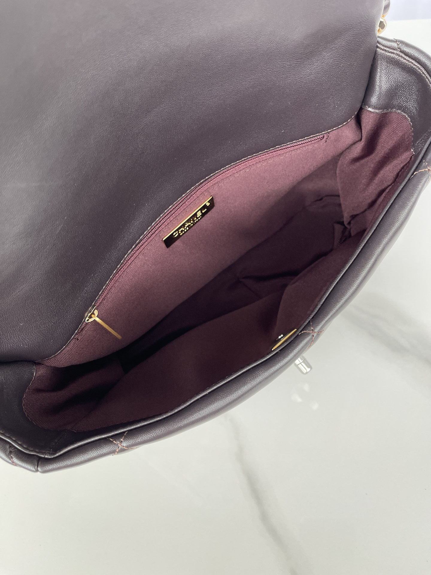 Ch*el 19 large handbag shiny leather black, gold-tone, silver-tone & ruthenium-finish metal 7.8 × 11.7 × 3.9 in