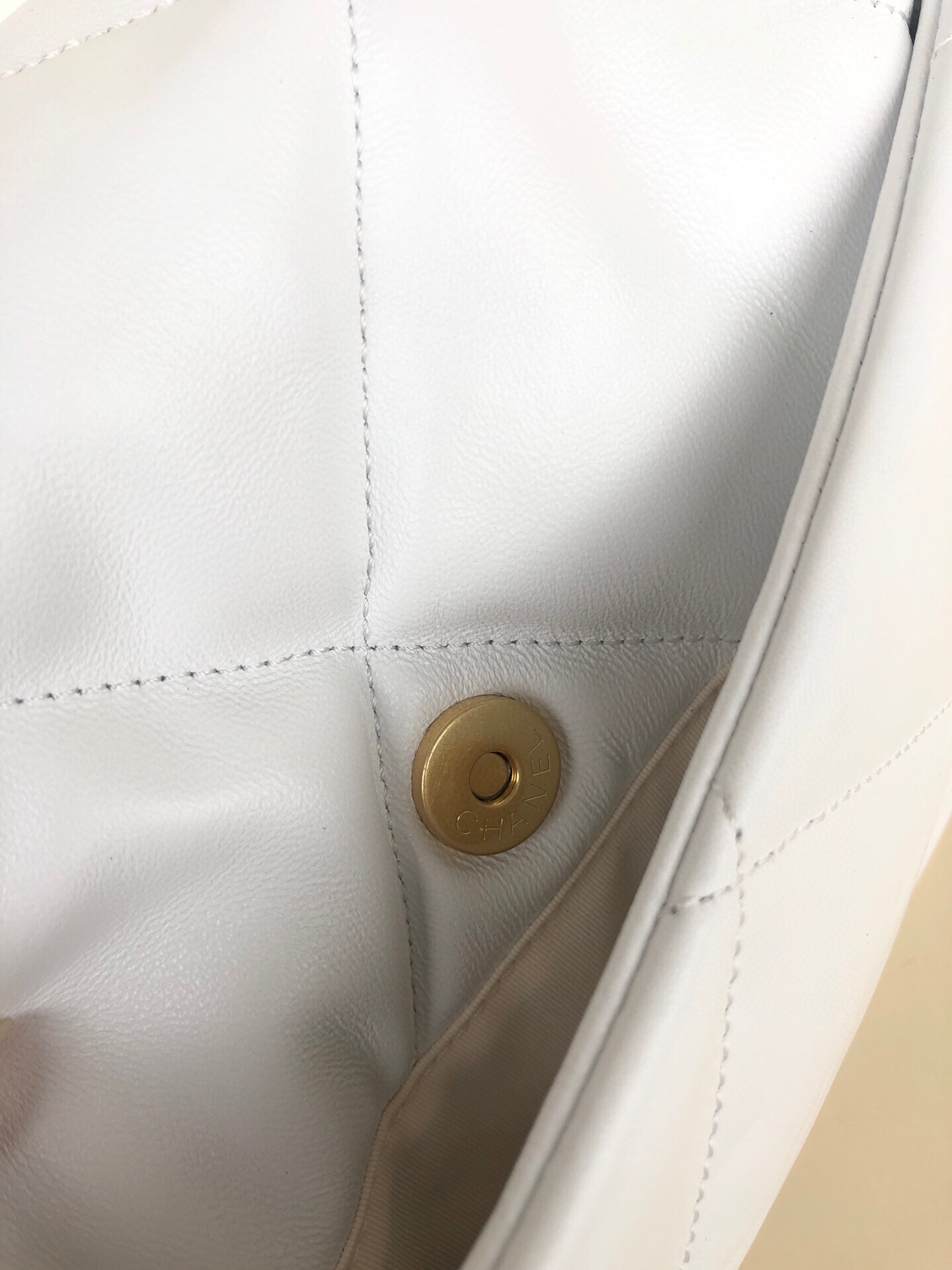 Ch*el 19 large handbag shiny leather, gold-tone, silver-tone & ruthenium-finish metal white 7.8 × 11.7 × 3.9 in