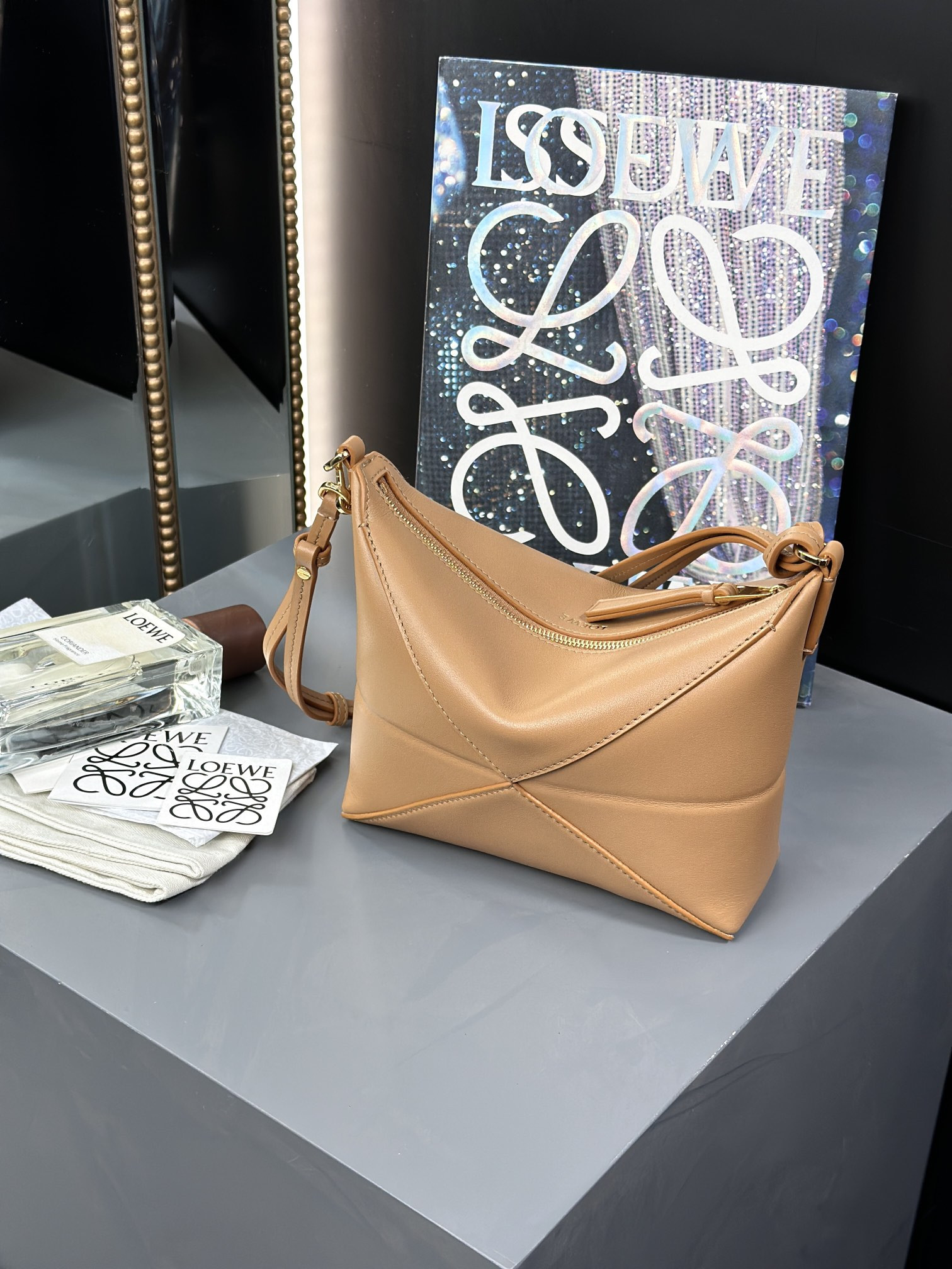 L0ew* puzzle fold pouch in shiny nappa calfskin 15.5x23x6.5cm